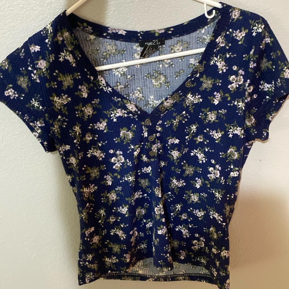 dark blue top with small flowers